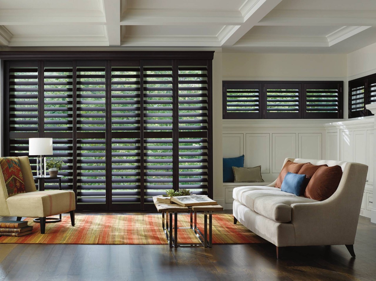 Hunter Douglas shutters filtering light in a living room near Traverse City, MI