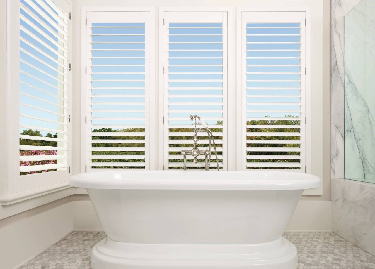 Hunter Douglas shutters blocking light in a bathroom near Traverse City, MI